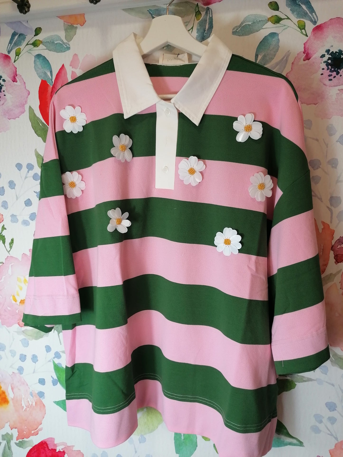 Polo over righe e fiori verde