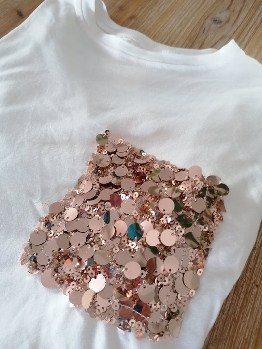 T shirt con tasca in paillettes